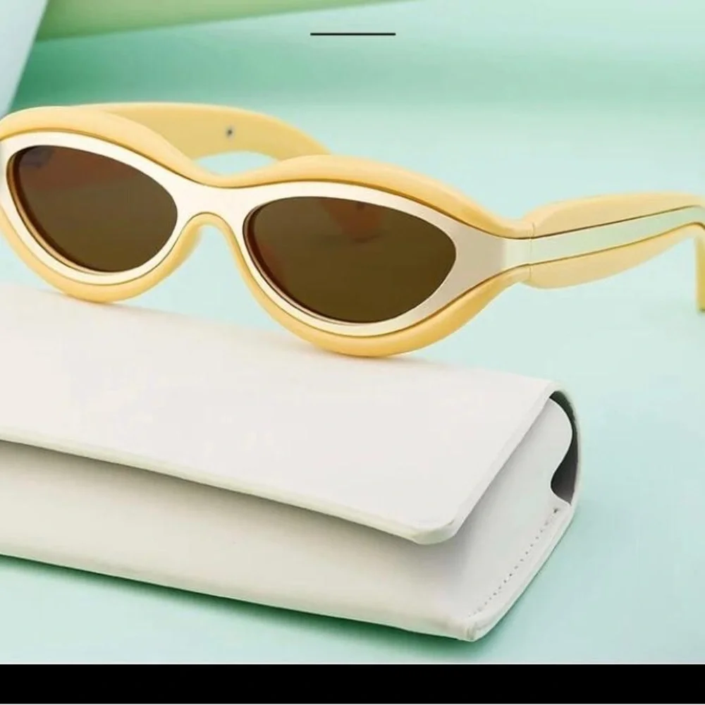 Luxury futuristic cat eye oval mustard pastel yellow steampunk sunglasses